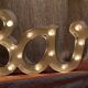 Ancient Light Sign in aluminium lettering forming the word "BAR"