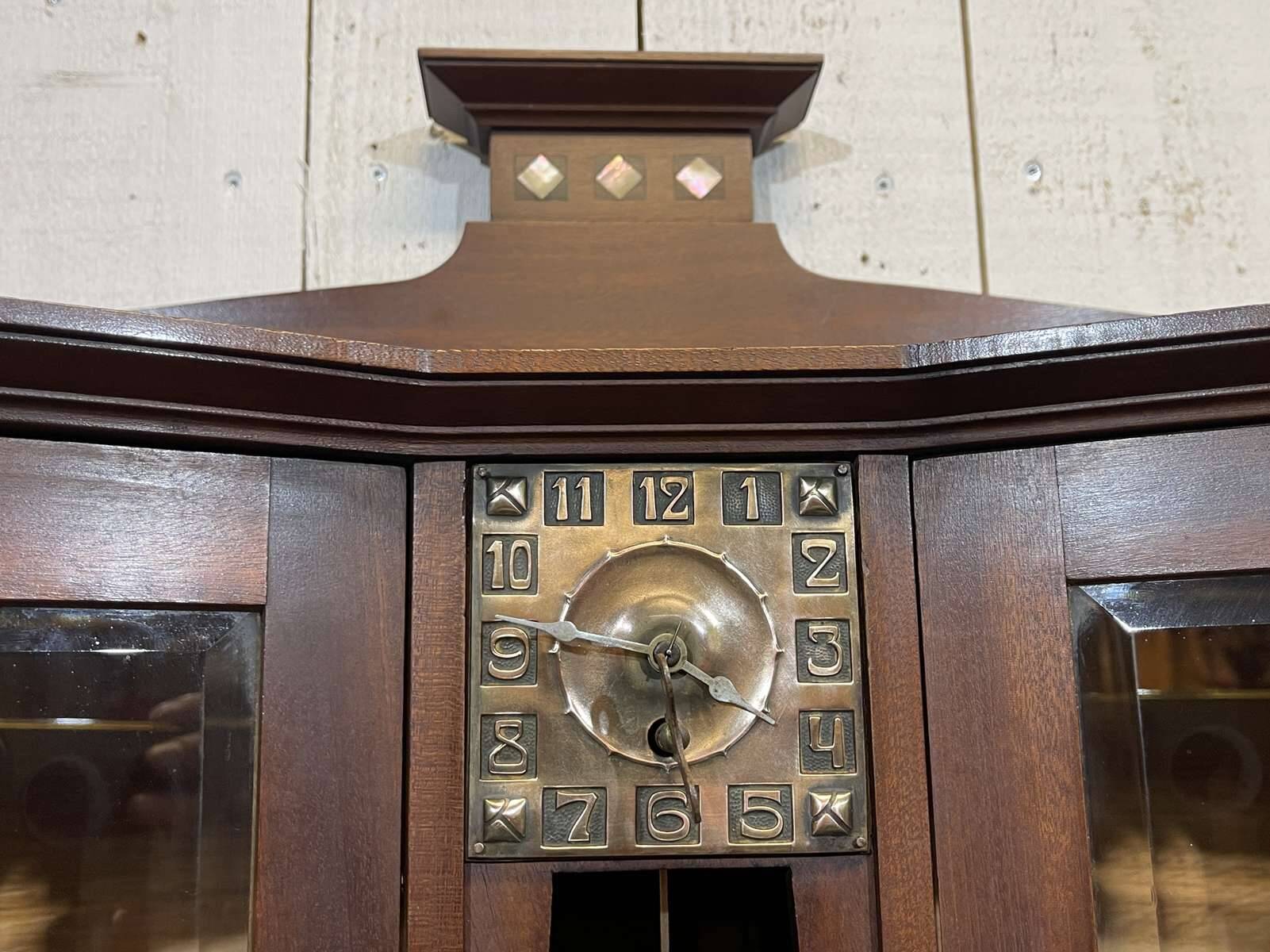 Art Nouveau mahogany buffet with clock in the style of G. Serrurier Bovy.