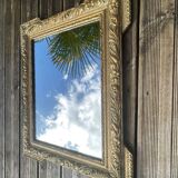 Miroir en bois et stuc doré