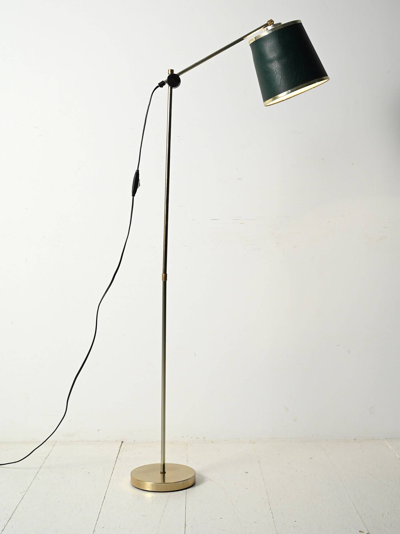 Brass floor lamp with green leather
