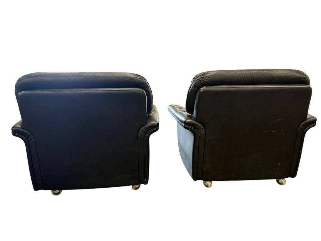 Set of 2 vintage black leather armchairs / individual armchairs