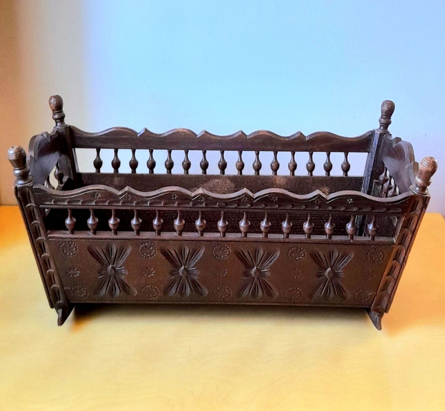 Carved wooden dolls cradle
