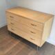 Eggshell lacquered chest of drawers with brushed steel legs. In the style of Knoll.