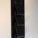 Leather wall-mounted magazine rack. Attributed to Jacques Adnet