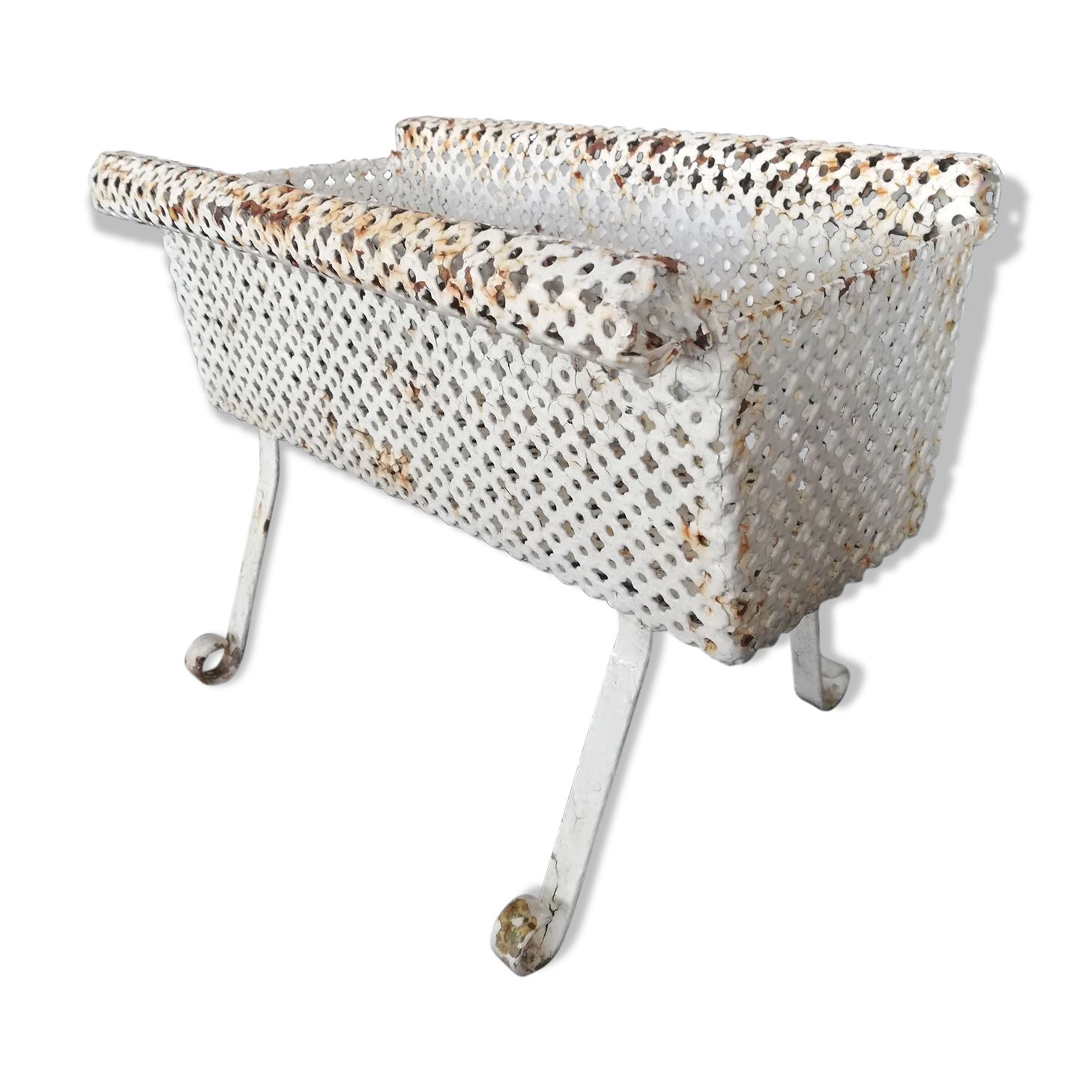 Wrought iron planter hides perforated sheet metal pot