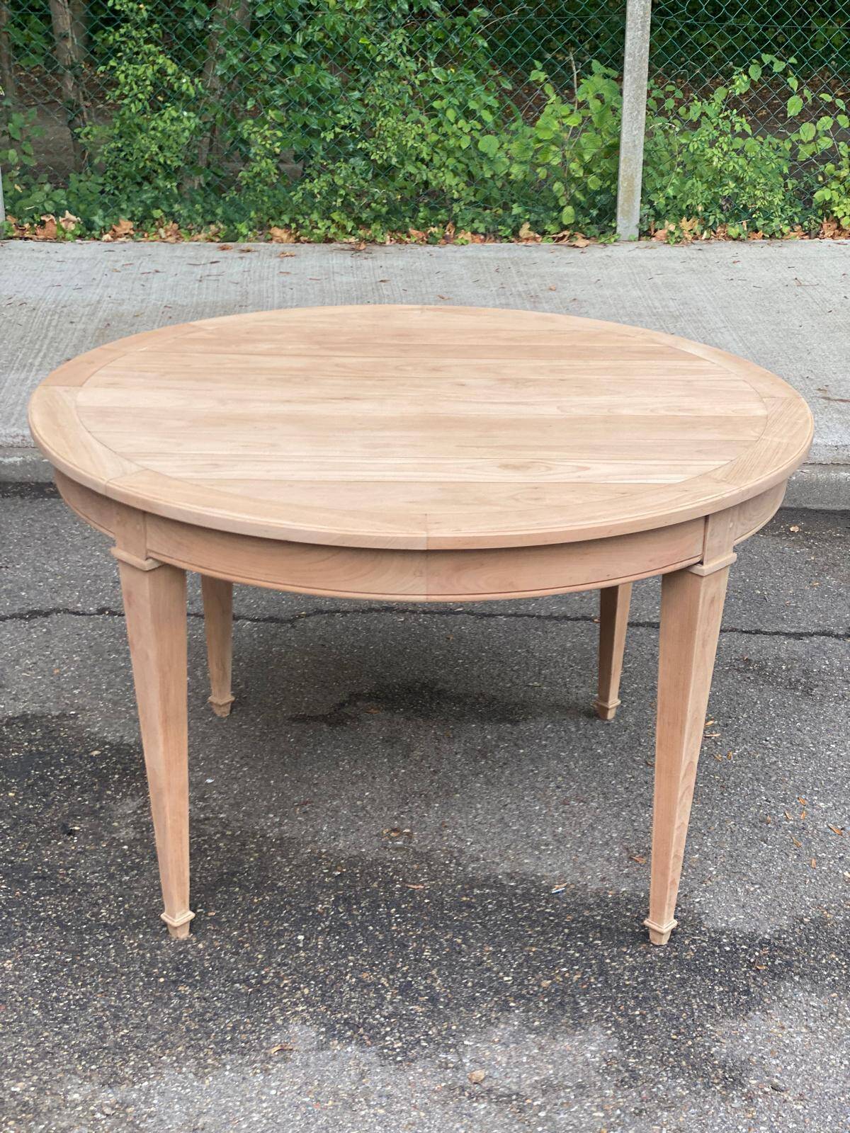 Round extendable dining table stripped in cherry wood Louis XVI René Trotel 1