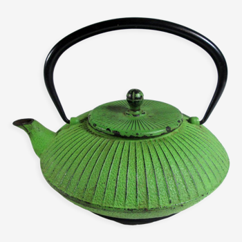 Flat cast iron teapot