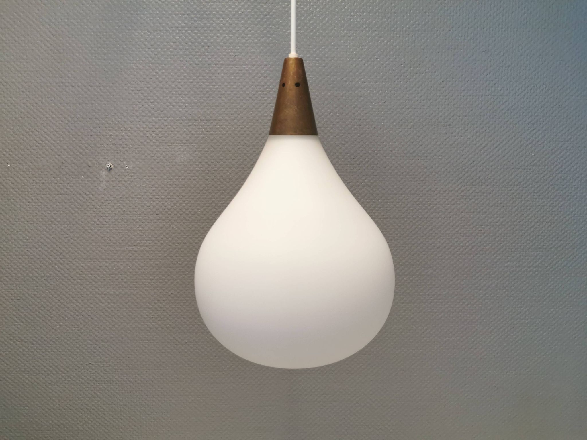 Large hanging lamp in white opal glass with brass top. Danish and estimated from the 1970s.