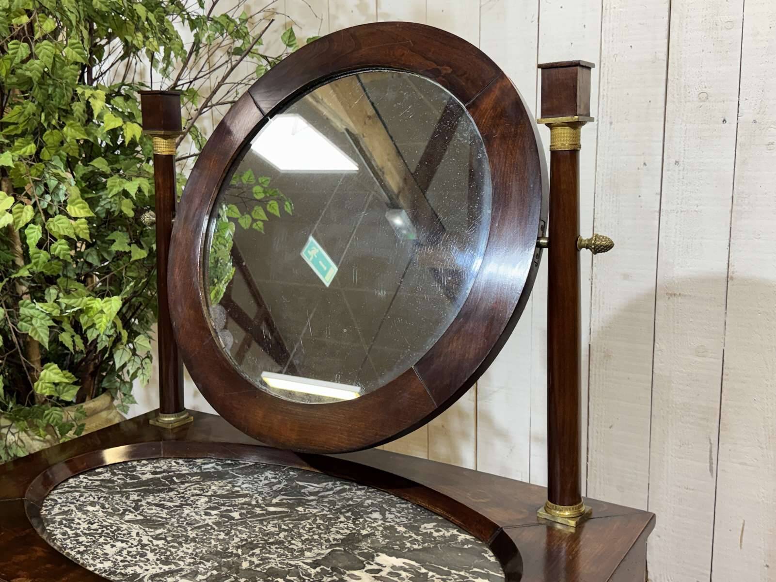 Empire hairdresser from the 19th century in mahogany with a marble top.