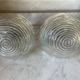 Pair of neoclassical wall sconces in twisted brass and ribbed glass.