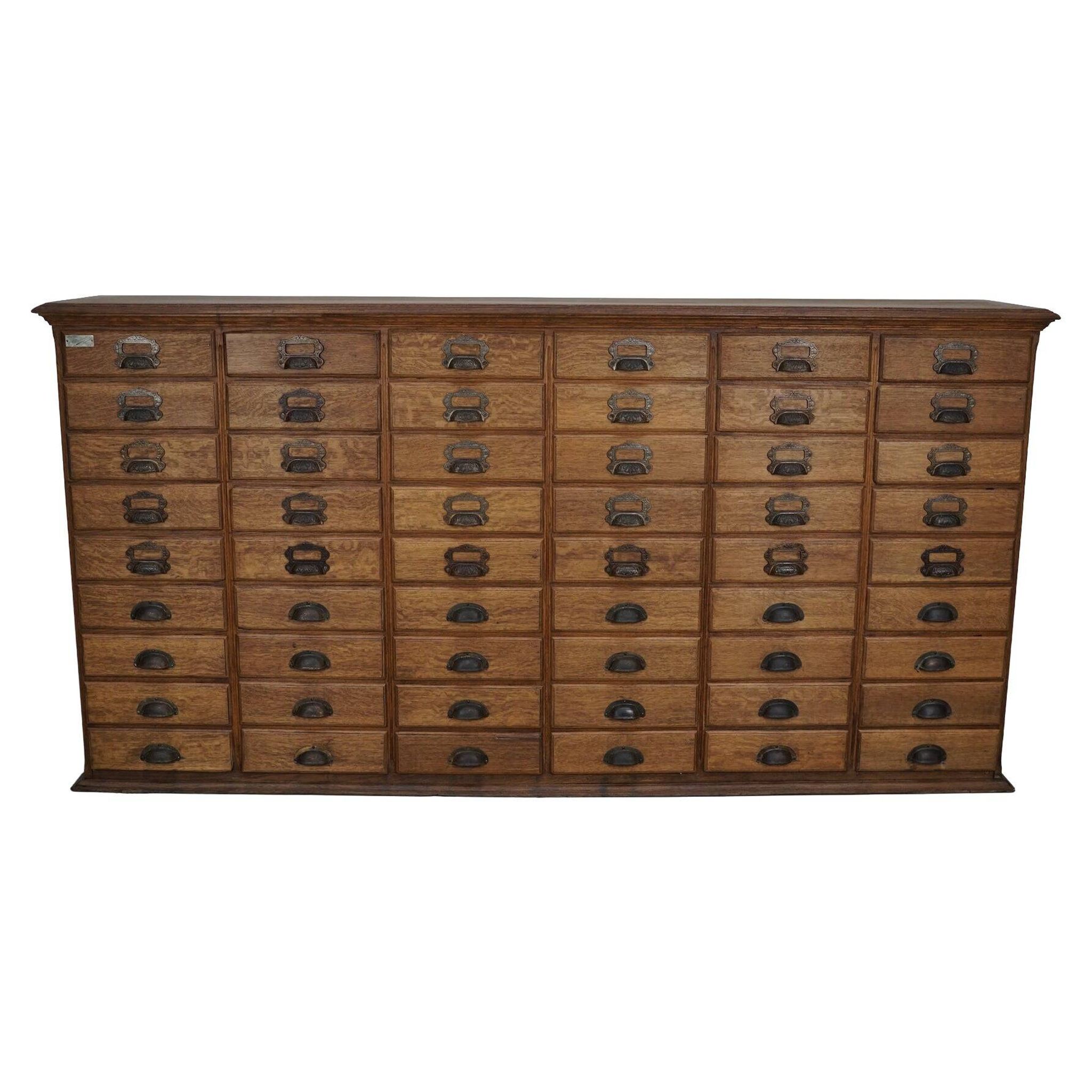Antique French oak filing / apothecary cabinet by Chouanard, ca 1910