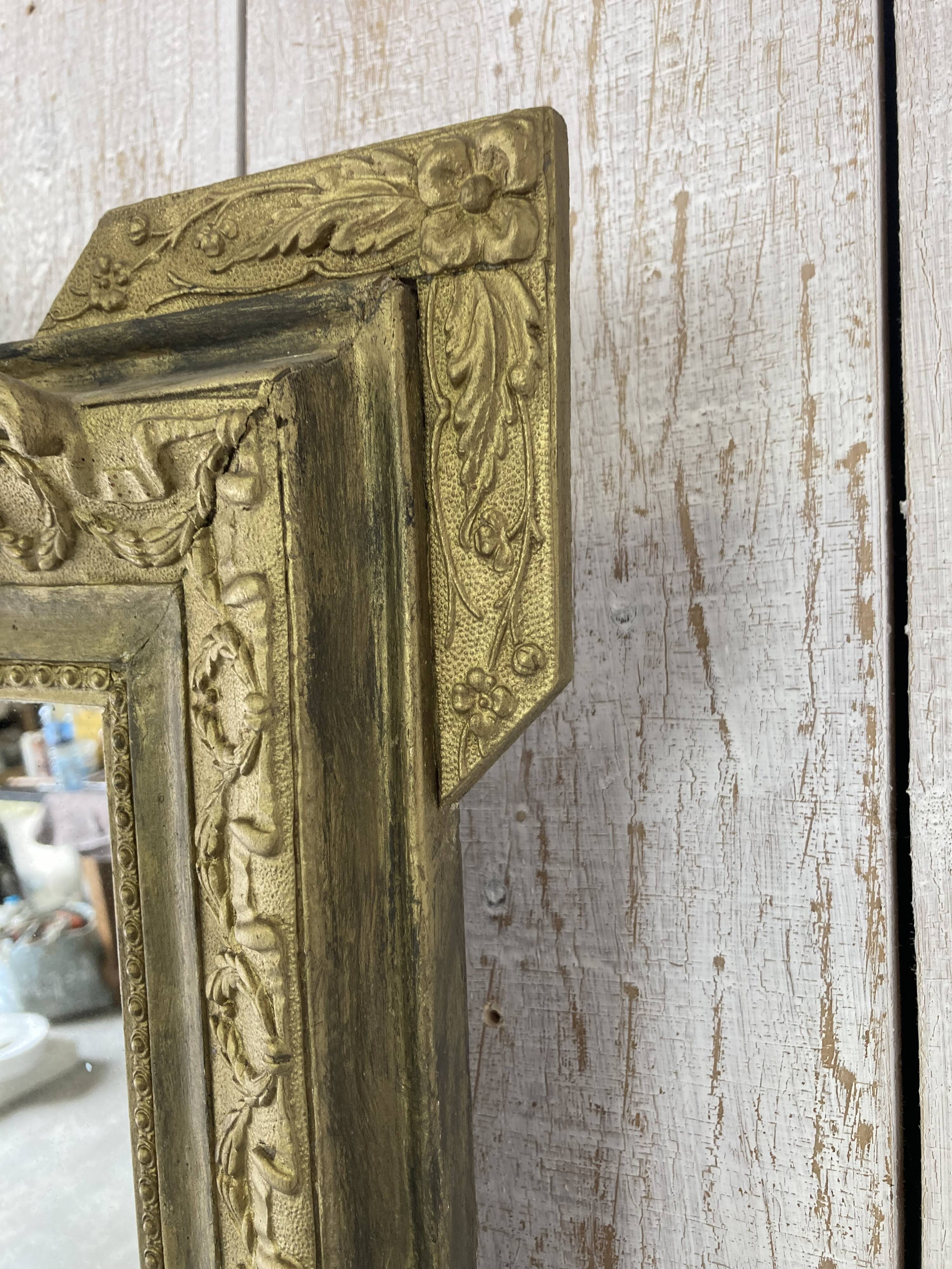 Antique mirror with a pediment