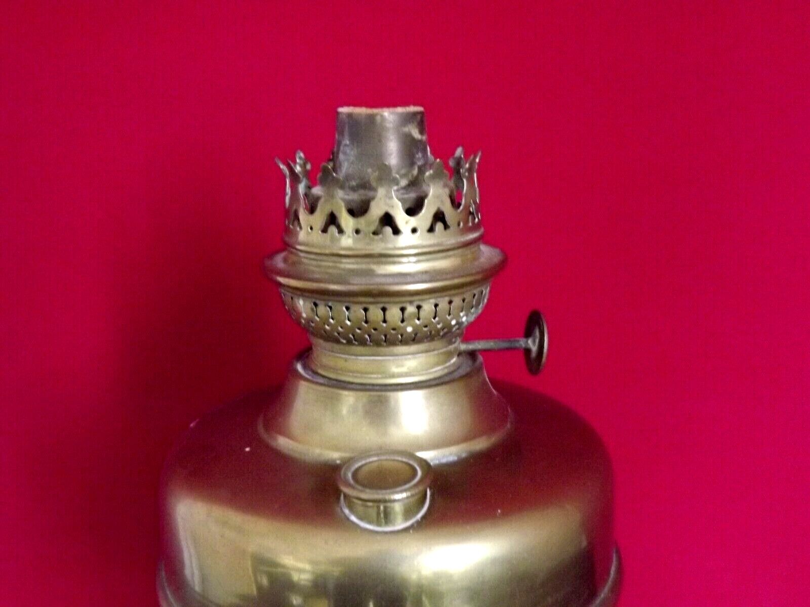 Vintage brass oil lantern with decorative base and transparent glass funnel stamped L B Brand Delay 4399.
