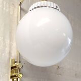 Opaline glass globe wall sconce with a gilt metal bracket - mid-20th century