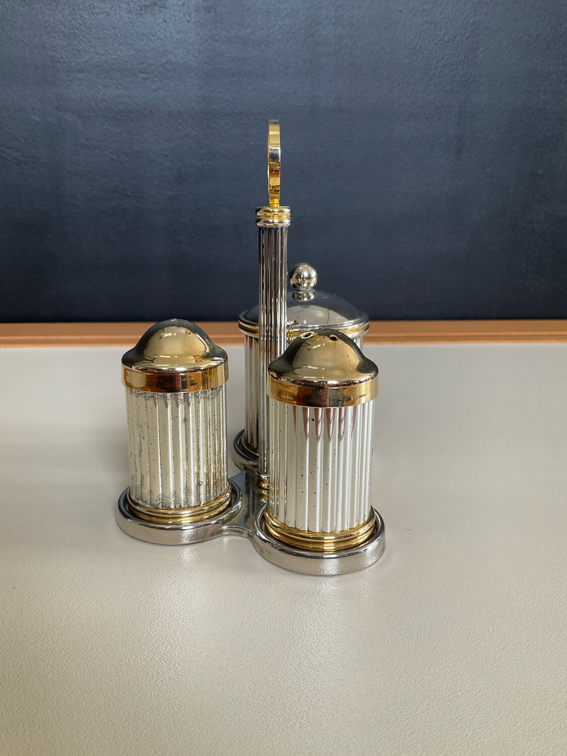 Vintage metal silver-plated and brass salt and pepper set.
