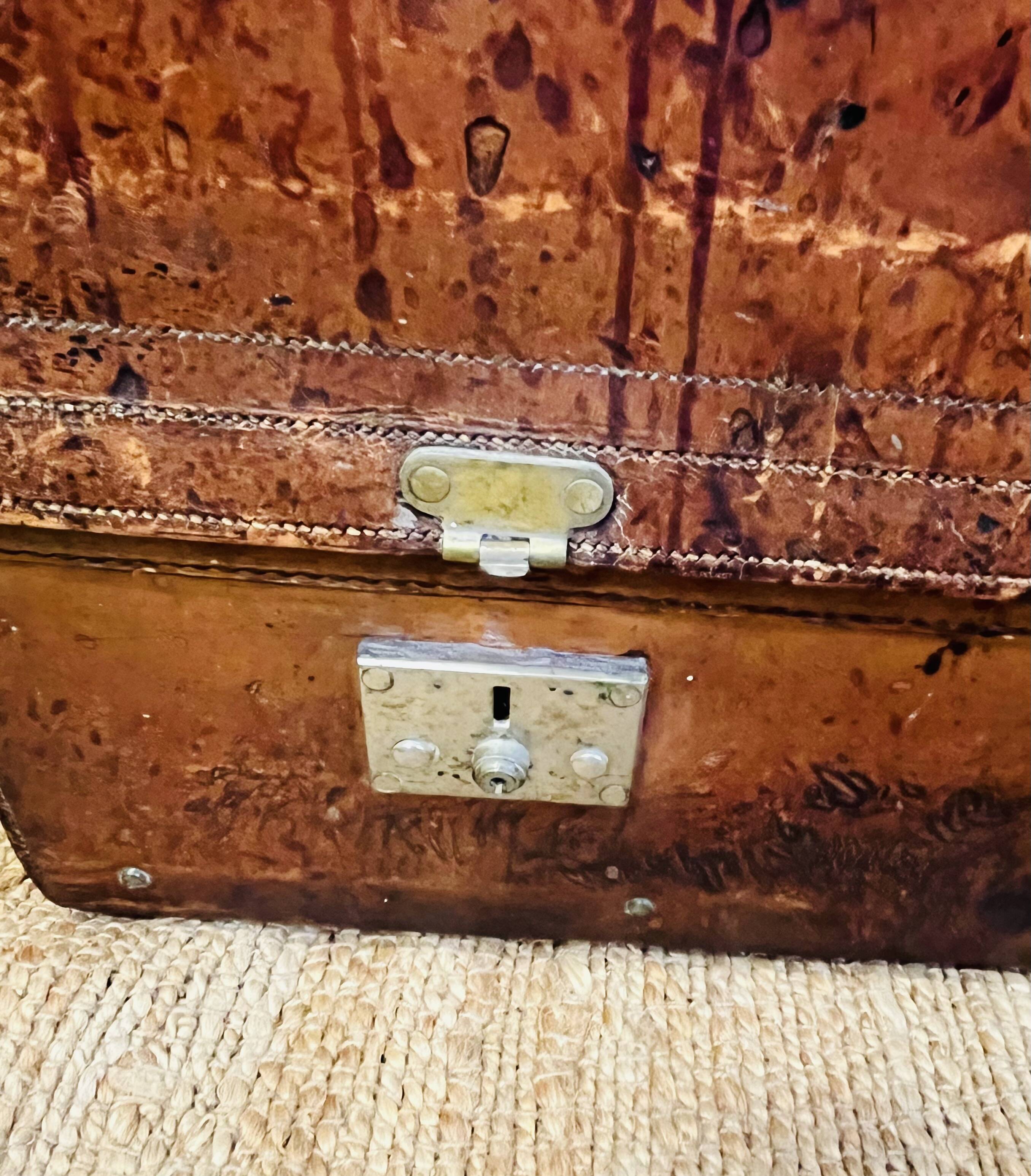 Large Gustave Keller leather trunk with multiple compartments