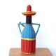 Bottle covered with scoubidou, musician, 60s