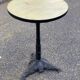Round bistro table in cast iron and Bakelite, Louis Vuitton style, 1930s.