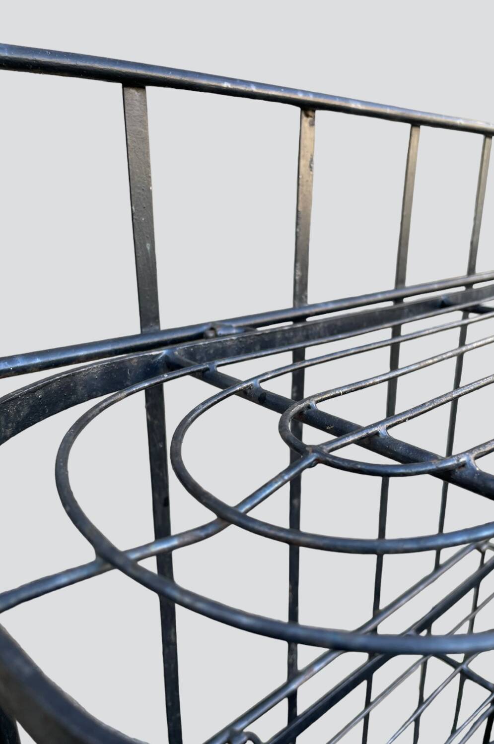 Old wrought iron garden shelf for plants