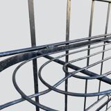 Old wrought iron garden shelf for plants