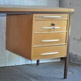 Mid-century Hungarian brown wooden desk with symmetrical drawers and white handles.