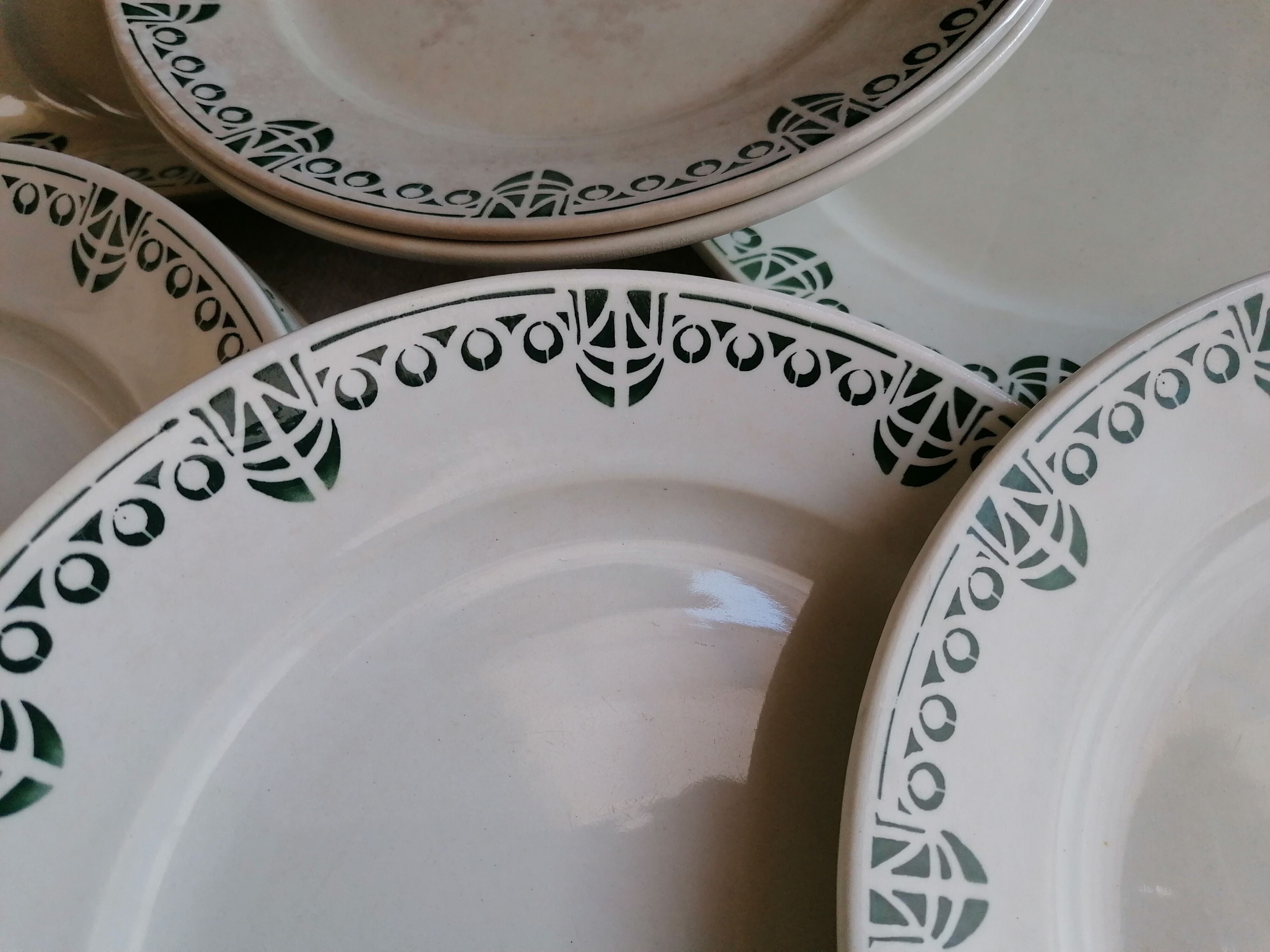 Set of 11 flat earthenware plates