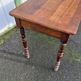 Wooden side table with turned legs