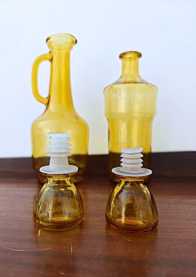 Set of two vintage amber glass carafes attributed to Lubiana.