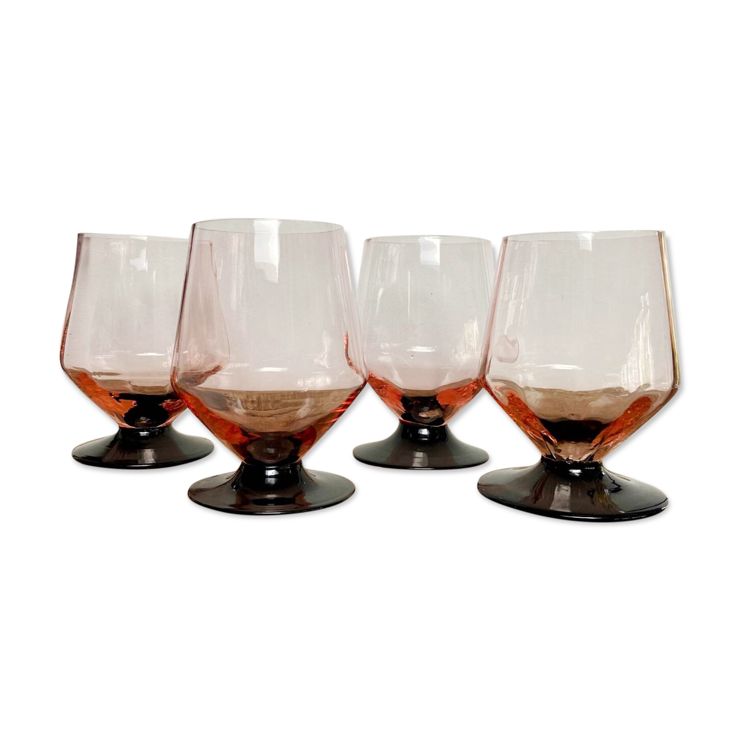 4 pink glasses with black stems