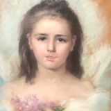 Portrait of a young girl with lilacs