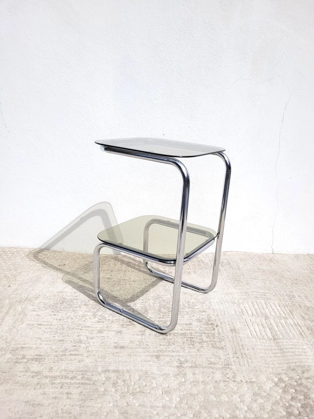 Vintage 1970s side table in chrome metal and smoked glass.