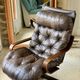 1970s Scandinavian armchair in curved laminated wood with a leather seat.