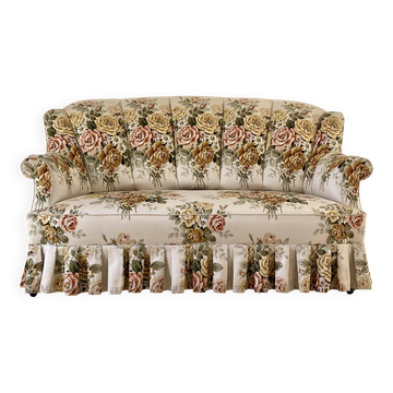 Napoleon III floral toad sofa with boudoir spirit and sliced backrest.