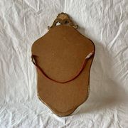 Ancien miroir mural biseauté en bois massif doré