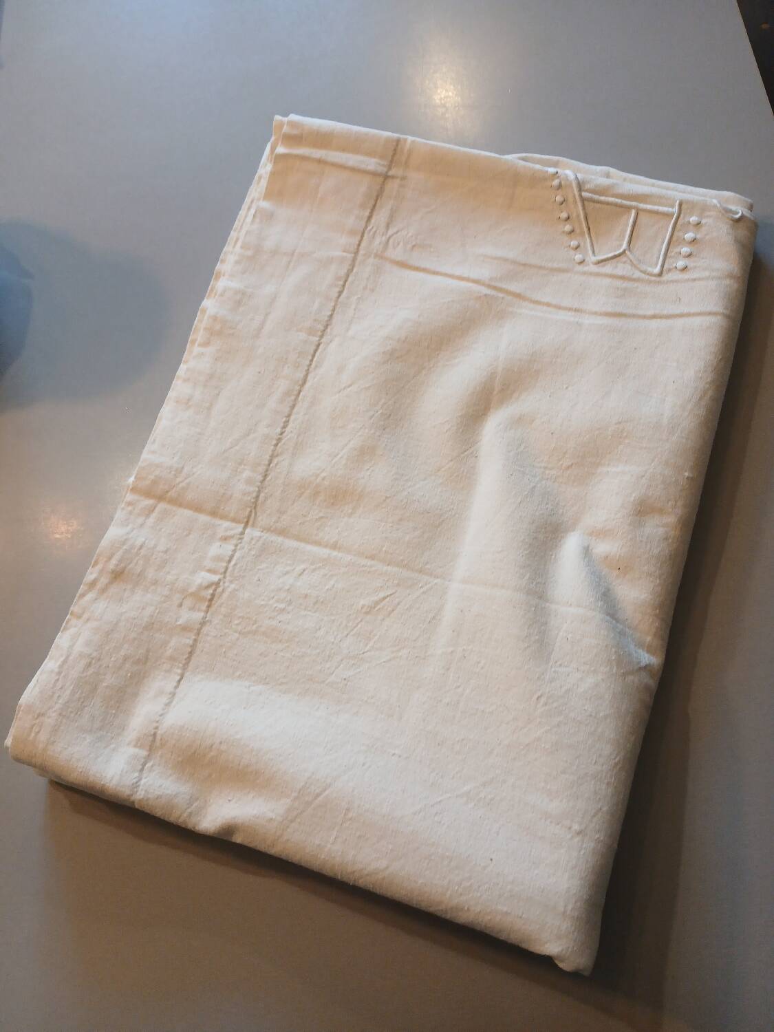 Antique sheet with embroidered initials