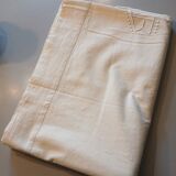 Antique sheet with embroidered initials