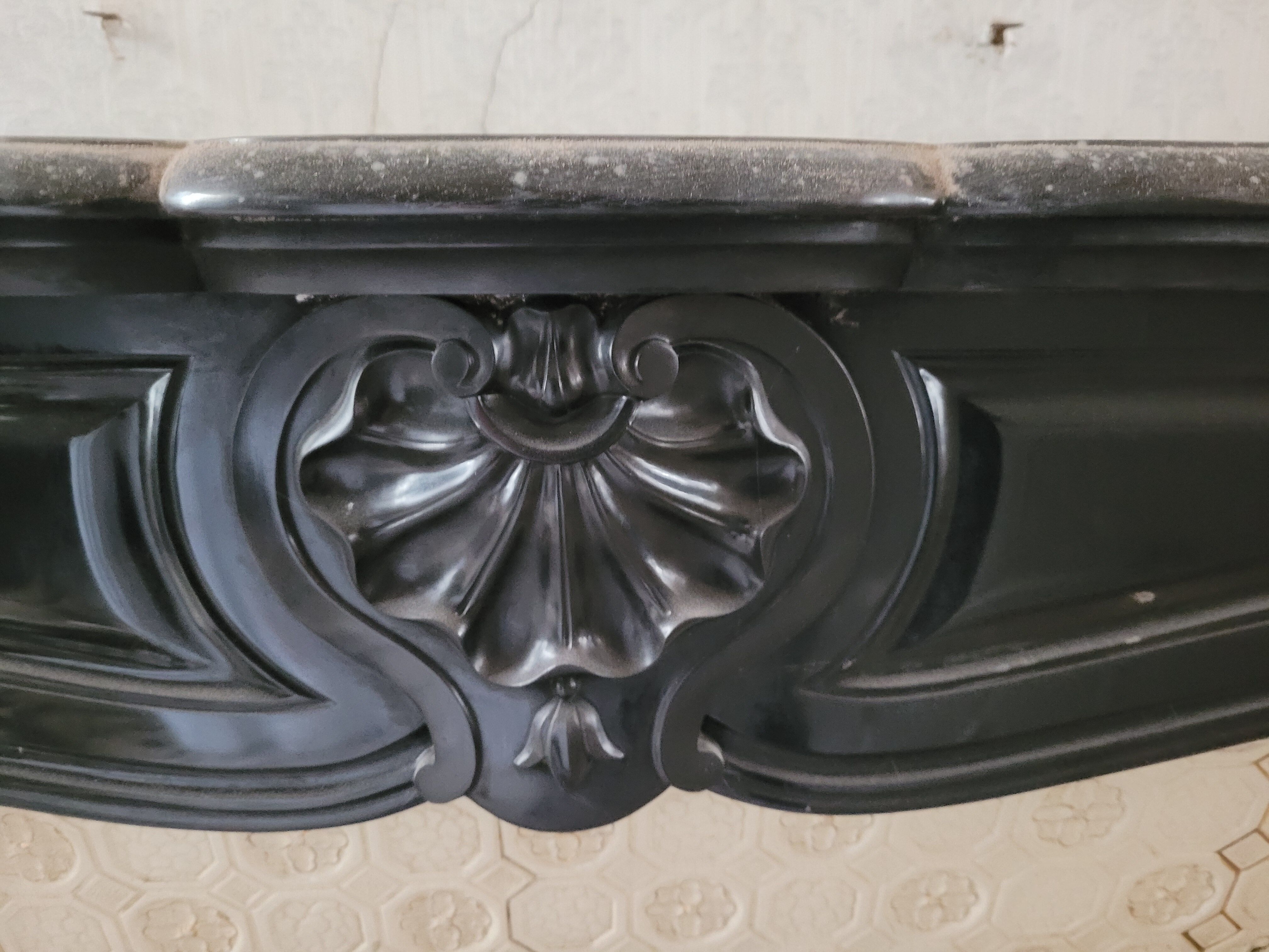 Louis XV style fireplace in black marble