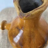 Provençal jug in orange/caramel glazed earthenware