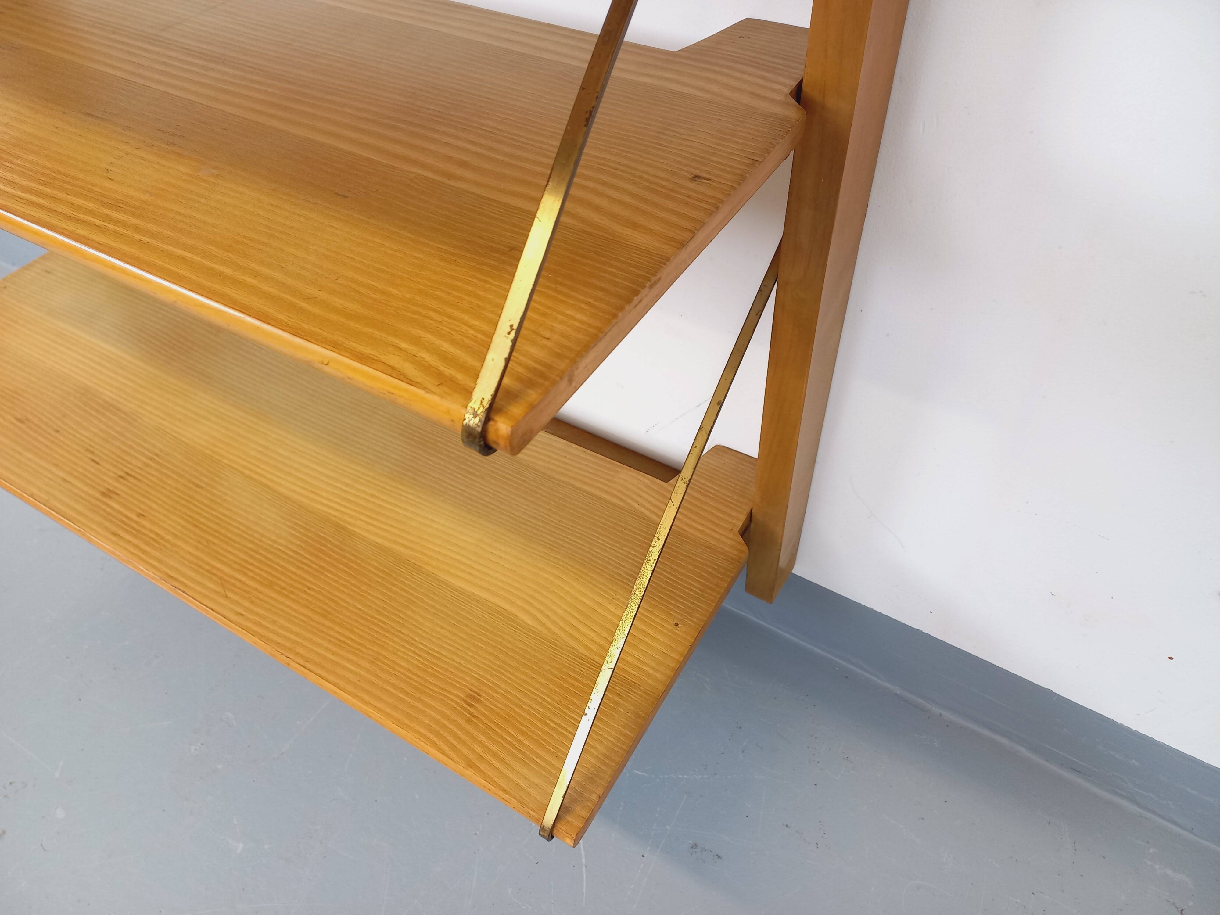 Wall shelf library with vintage light wood secretary bar