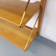 Wall shelf library with vintage light wood secretary bar