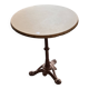 Cast iron base side table with a stone-effect top.