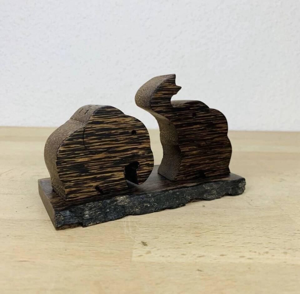 Vintage palm wood elephant salt and pepper shakers.