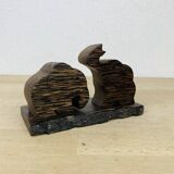 Vintage palm wood elephant salt and pepper shakers.