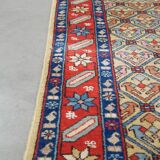 Colorful oriental runner with contrasting borders and cozy patterns, measuring 314x92 cm