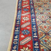 Colorful oriental runner with contrasting borders and cozy patterns, measuring 314x92 cm