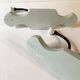 Antique metal and porcelain coat hooks, painted wooden support