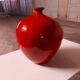Vase rouge en céramique émaillée