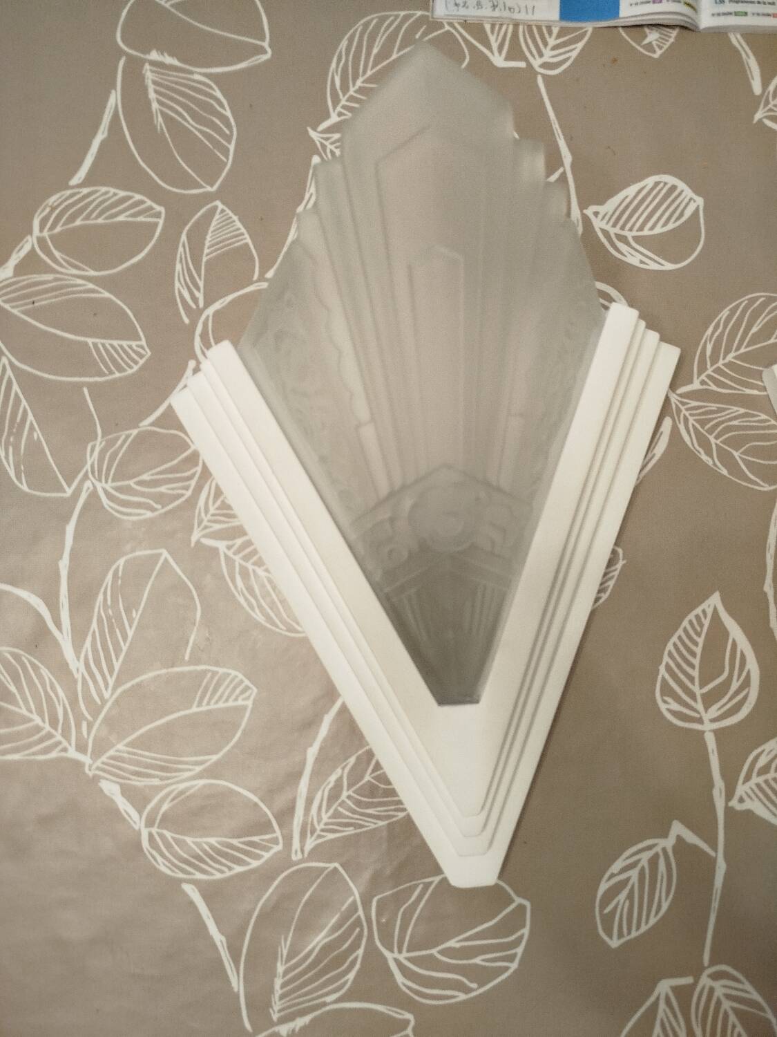 Pair of Art Deco wall sconces in plaster and pressed glass.