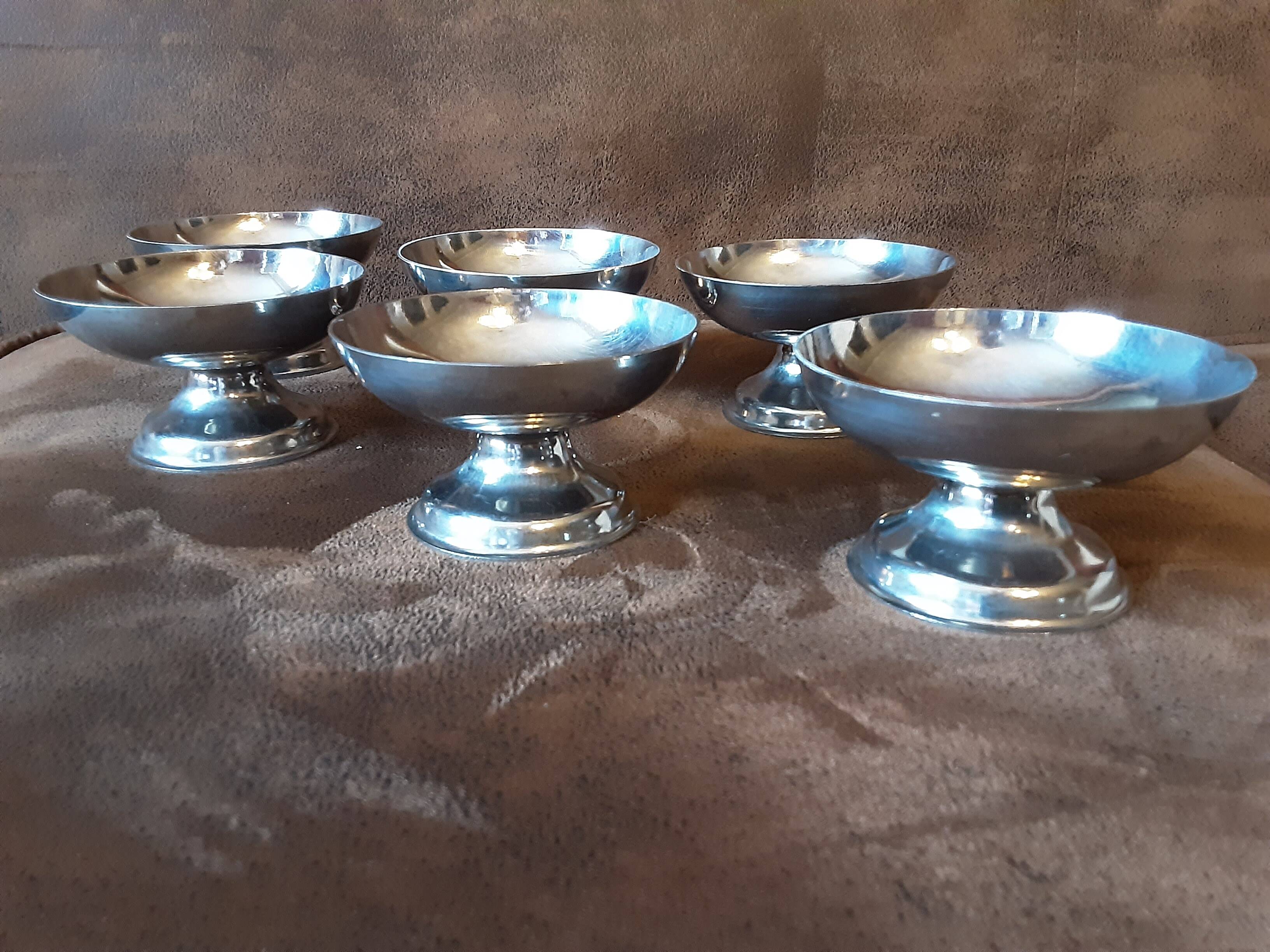 Set of 6 footed bowls. Metal