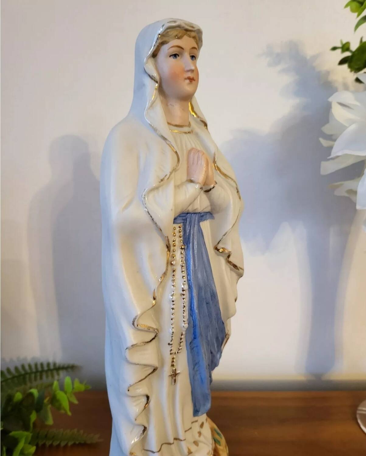Religious statuette of the Virgin Mary in bisque porcelain